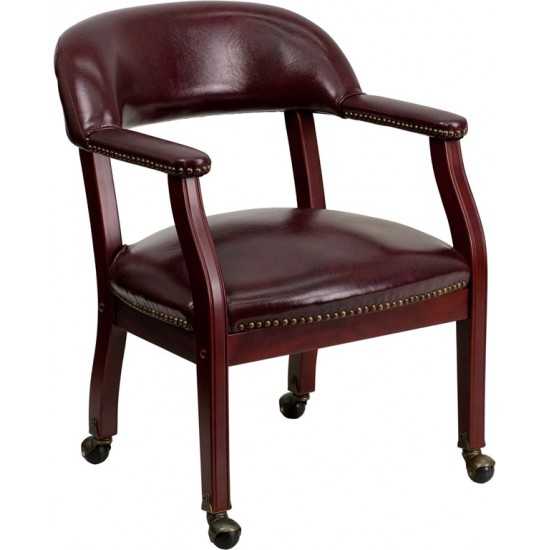 Oxblood Vinyl Luxurious Conference Chair with Accent Nail Trim and Casters